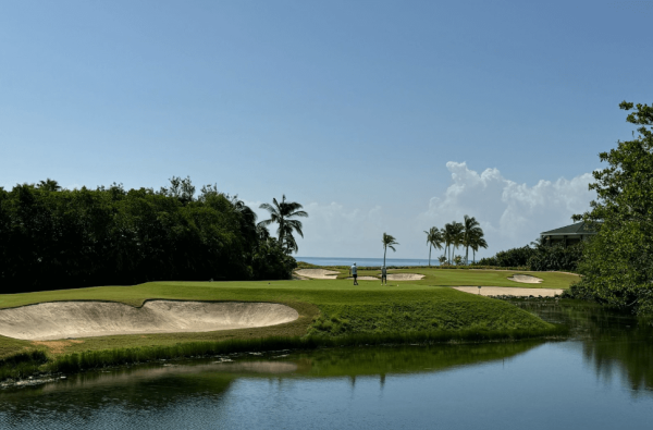 golf course weaves between canals and ocean water